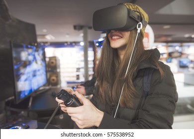 Woman Is Trying Out A Virtual Reality Device In A Retail Electronics Store