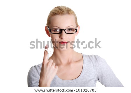 Woman trying to remember what the piece of string round her finger was meant to remind her of, isolated on white background.