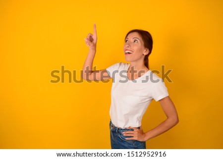woman in a t-shirt shows her finger a place free