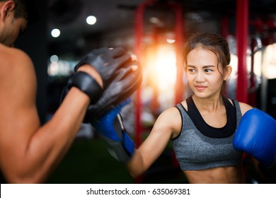 Woman ttaining for Fitness boxing in Thailand Gym, Fitness, exercise, slim and healthy concept.