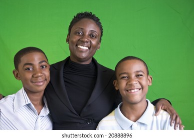 A woman with two boys who appear to be her children.
