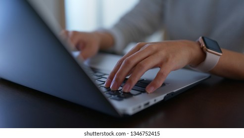 Woman type on computer at home - Shutterstock ID 1346752415