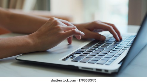 Woman type on laptop computer, work from home concept