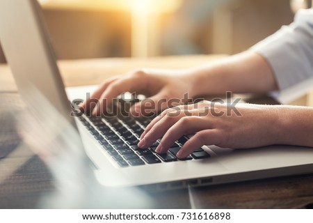 Woman typing computer.