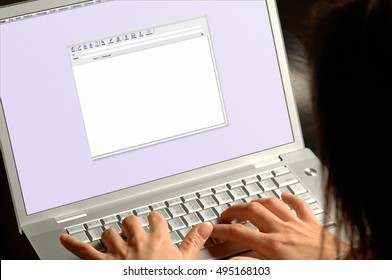 Woman Typing Email On Laptop Computer