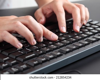 Woman typing on keyboard. 