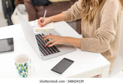 Woman Typing On Laptop