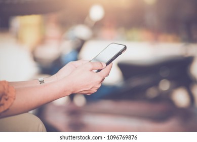 Woman typing text message on smart phone - Shutterstock ID 1096769876