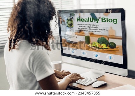 Woman ues laptop with healthy blog online social media content, food blogging, working online, content creator, health, blogger, technology, weblog, wellness, woman reading healthy blog online at home