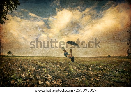 Similar – person with umbrella on rainy day