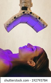 A Woman Under A Light Therapy Machine, Blue Light