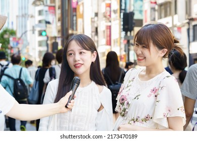 A Woman Undergoing A Street Interview