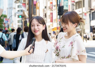 A Woman Undergoing A Street Interview