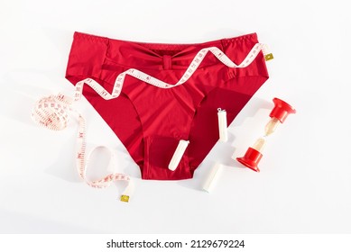 Woman Underpants, Tampons And Metric Measuring Tape. Concept Of Premenstrual Syndrome, Critical Days, Abdominal Pain And Bloating. Menstruation, Menstrual Cycle, Women's Health, Feminine Hygiene, Pms.