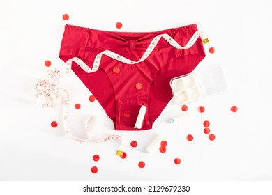 Woman Underpants, Tampons And Metric Measuring Tape. Concept Of Premenstrual Syndrome, Critical Days, Abdominal Pain And Bloating. Menstruation, Menstrual Cycle, Women's Health, Feminine Hygiene, Pms.