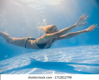 Woman underwater at the swimming pool