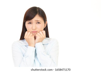 Woman with an uneasy look. - Shutterstock ID 1658471170