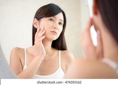 Woman with an uneasy look. - Shutterstock ID 474355162