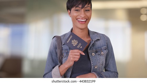 Woman With US Passport In Airport Terminal While Waiting For Flight