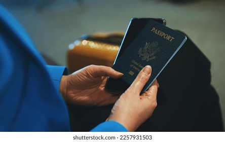 Woman with USA passport is waiting for her flight at the airport.
