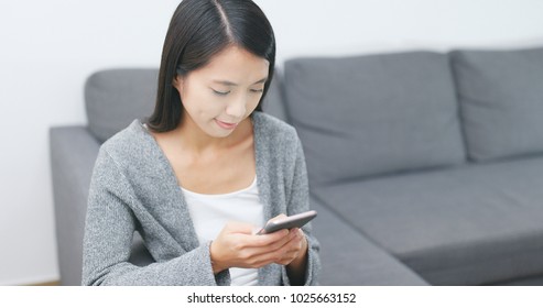 Woman use cellphone at home 