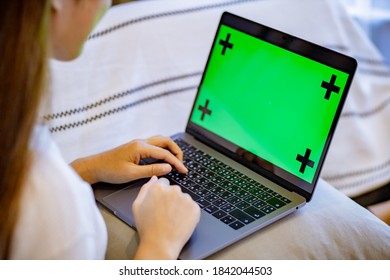 Woman Use Laptop With Greenscreen.