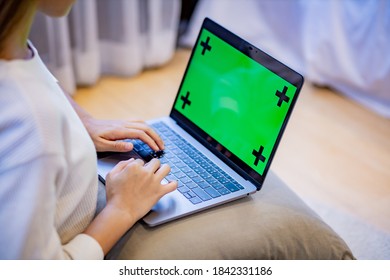 Woman Use Laptop With Greenscreen.