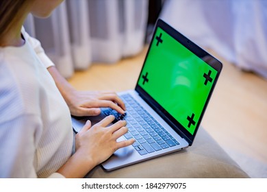 Woman Use Laptop With Greenscreen.