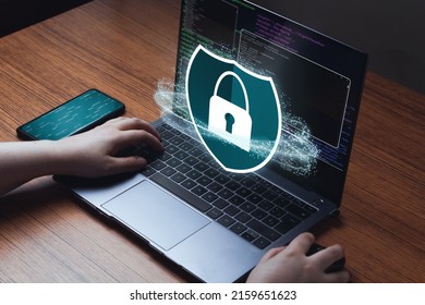 Woman use laptop with protection interface. Internet of things. Cybersecurity concept. Icon shield with a lock symbol and encryption screen. Protection against dangers.