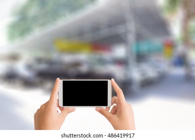 Woman Use Mobile Phone And Blurred Image Of Used Car Tent ,second Hand Cars For Sale