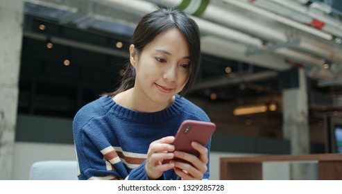 Woman use of mobile phone in city  - Shutterstock ID 1329285728