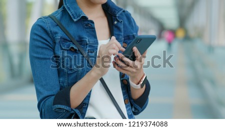 Similar – Young Woman Checking Her Mobile Phone