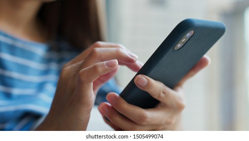 Woman use of mobile phone at home - Shutterstock ID 1505499074