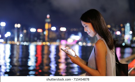 Woman Use Of Mobile Phone In Hong Kong At Night