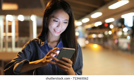 Woman Use Of Smart Phone In The City 