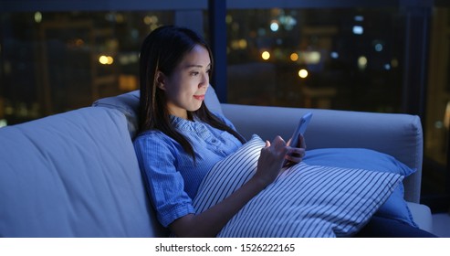 Woman Use Of Smart Phone Online At Night