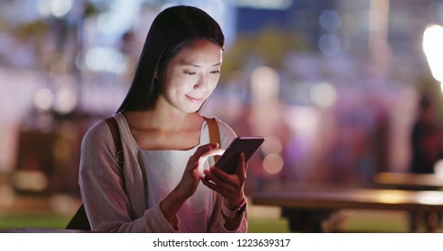 Woman Use Of Smart Phone In Outdoor Coffee Shop