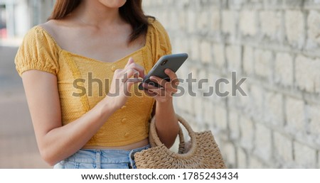 Similar – Young Woman Checking Her Mobile Phone