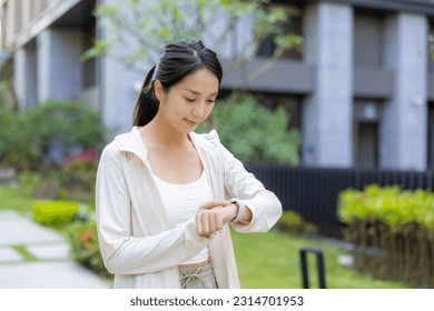 Woman use of smart watch at outdoor - Powered by Shutterstock