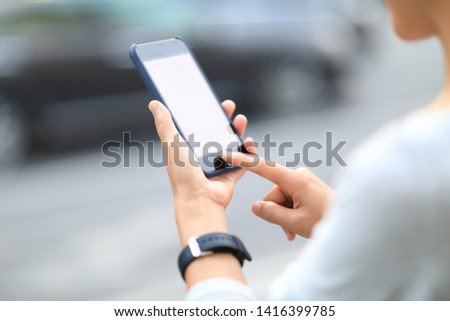 Woman use smartphone at city