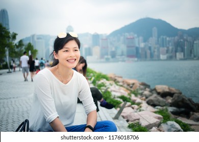 Woman Use Smartphone In West Kowloon Cultural District