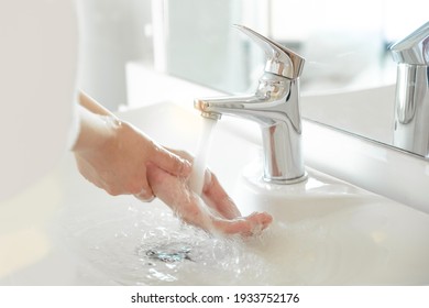 Woman Use Soap And Washing Hands Rubbing With Soap Under The Water Tap. Hygiene New Normal Concept To Stop Spreading Coronavirus Or Influenza Virus In Hospital Or Public Wash Room.