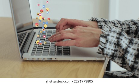 Woman uses laptop computer, types chat messages. 3D emoji, meme icons flying out of device. - Powered by Shutterstock