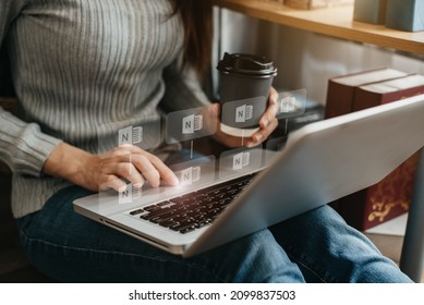 Woman uses a laptop to search for information in the home in the morning.