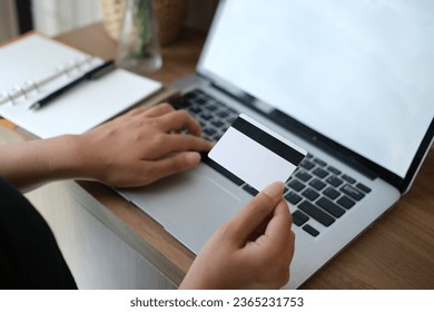 woman uses smart tablet computer and holds credit card with online shopping.Online payment concept. - Shutterstock ID 2365231753
