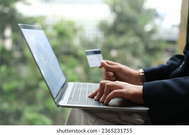 woman uses smart tablet computer and holds credit card with online shopping.Online payment concept. - Shutterstock ID 2365231755