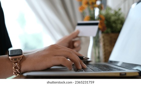 woman uses smart tablet computer and holds credit card with online shopping.Online payment concept. - Shutterstock ID 2365231759