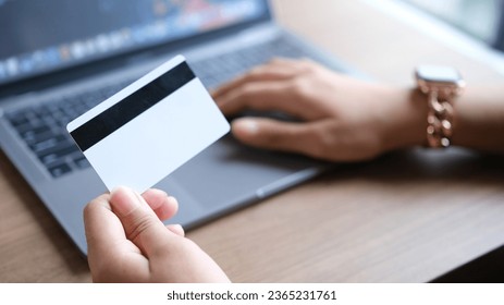 woman uses smart tablet computer and holds credit card with online shopping.Online payment concept. - Shutterstock ID 2365231761