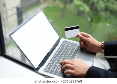 woman uses smart tablet computer and holds credit card with online shopping.Online payment concept. - Shutterstock ID 2365231763