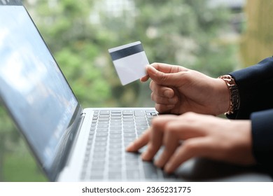 woman uses smart tablet computer and holds credit card with online shopping.Online payment concept. - Shutterstock ID 2365231775